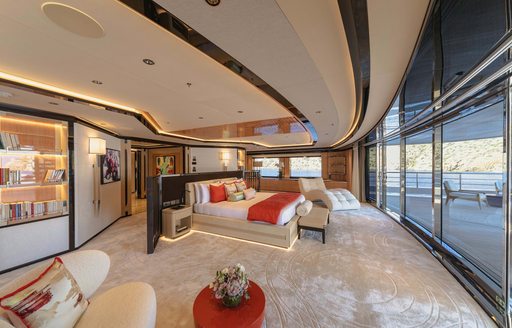 Master cabin onboard charter yacht PROJECT X, central berth facing extensive glazing and private exterior deck space