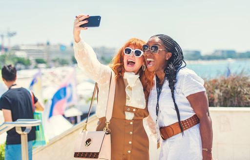 Young women take a selfie at the Cannes Lions International Festival of Creativity