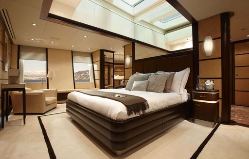 skylight looks over bed in the master suite on board motor yacht GLADIATOR 