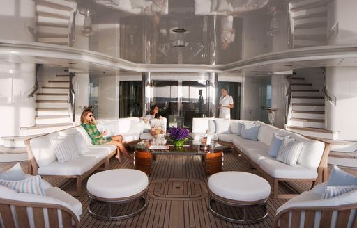 outdoor seating area on aft deck of superyacht Lady E