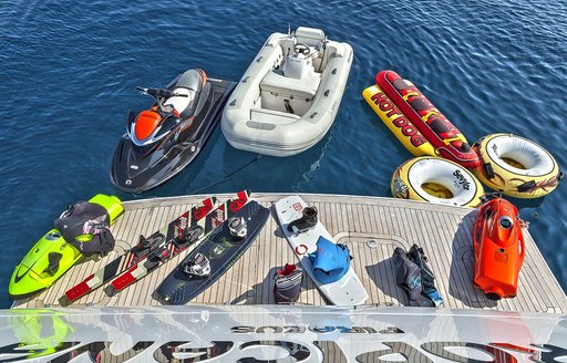 Water toys on charter yacht tropicana lined up on swim platform