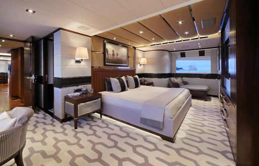 Master suite on luxury yacht AURELIA, with views over Mediterranean in background