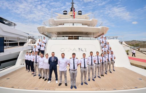 Crew of charter yacht O'PARI standing on deck