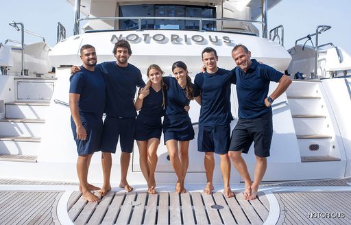 the ready and able crew of a superyacht in navy