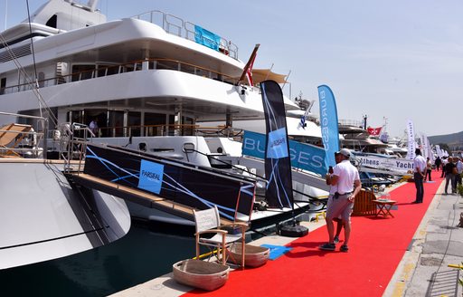 Attendees peruse the yachts at the Mediterranean Yacht Show in Greece