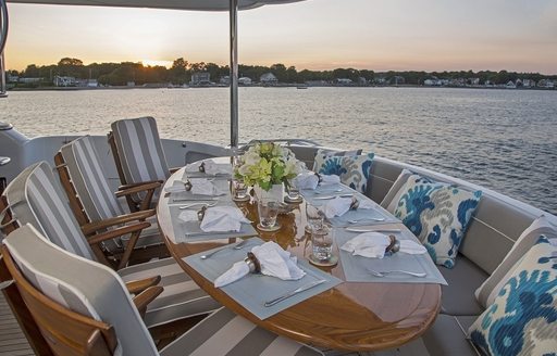 alfresco dining area at sunset on board luxury yacht ‘Gale Winds’ 