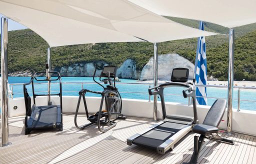 Gym equipment on the exterior deck onboard luxury charter yacht EMIR