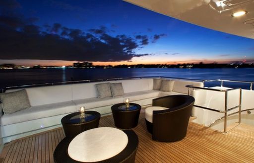 seating area on the sundeck of luxury yacht Milk and Honey as the sun sets