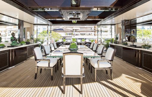 Alfresco aft deck dining on board charter yacht ILLUSION V