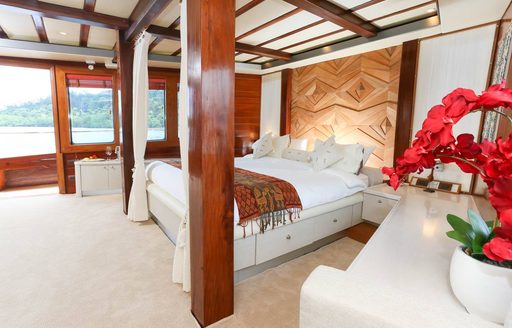 master suite with large windows on board charter yacht LAMIMA 