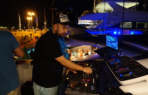 A DJ spins his decks at the Mediterranean Yacht Show in Greece