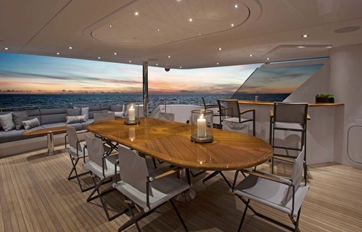 Alfresco dining area on aft deck of luxury yacht W