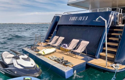 Swim platform and water toys with four deck chairs onboard charter yacht TIMBUKTU