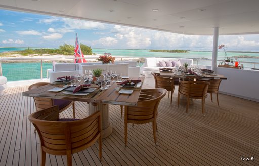 Aft deck alfresco dining set-up on superyacht DREAM
