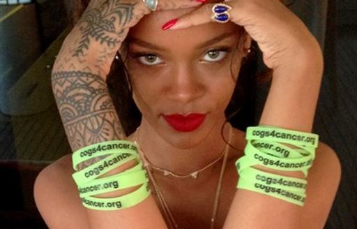 Bahamian pop star rihanna wearing cogs for cancer wristbands to show support