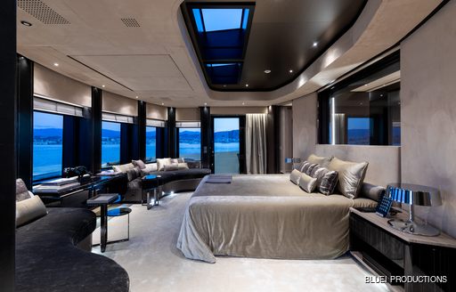 master suite flanked by full-length windows on board superyacht SOLO