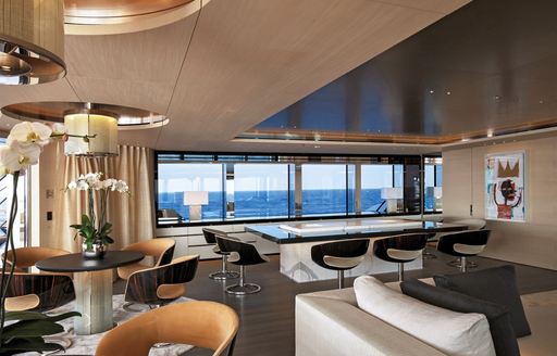 earth coloured upper deck salon aboard superyacht ‘Grace E’ 