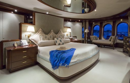 full-beam master suite with mahogany woodwork aboard motor yacht 'Blue Moon'