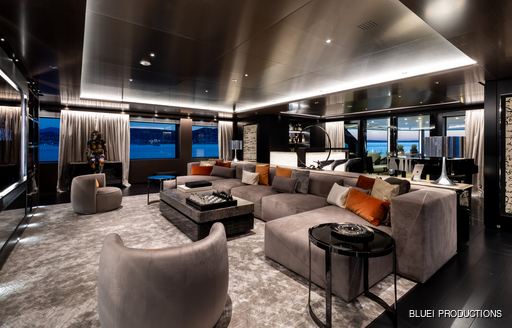 skylounge with plush seating area and bar on board luxury yacht SOLO
