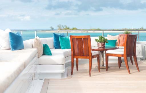 Exterior seating area onboard charter yacht JOIA THE CROWN JEWEL