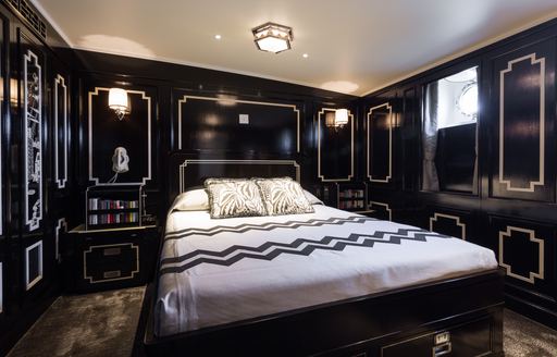 Black paneled art deco style double cabin on board classic yacht Malahne
