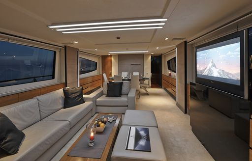 leather sofa and armchairs in main salon of charter yacht QUANTUM 