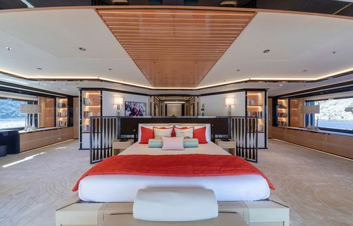 Overview of the master cabin onboard charter yacht PROJECT X, central berth facing forward with large windows on either side