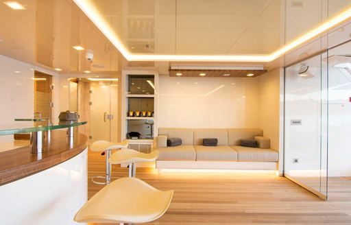 motor yacht optasia beach club with soft seating and massage room 