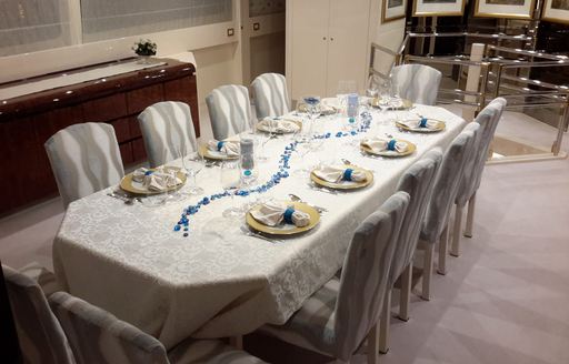 table set up for formal dining on board motor yacht LADYSHIP 