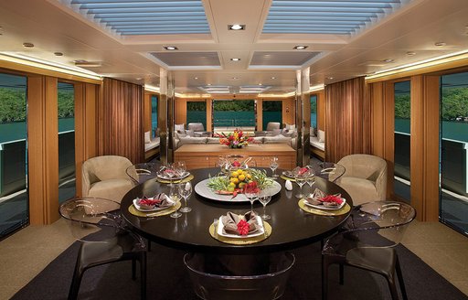 contemporary main salon with rich woods on superyacht ‘Big Fish’ 