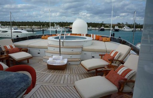 Jacuzzi and sun loungers on sun deck of motor yacht claire