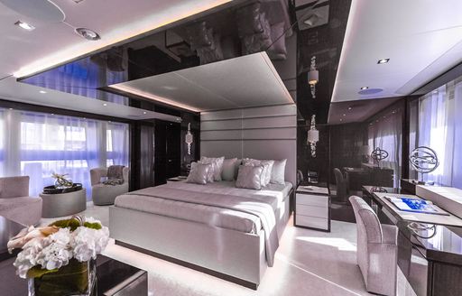 Aqua Libra owner's suite, with large bed and wide windows