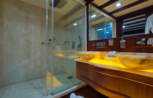 en-suite marble bathroom forming part of the master suite on board charter yacht Aria I 