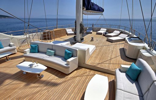 Exterior deck onboard charter yacht MEIRA with multiple sun loungers