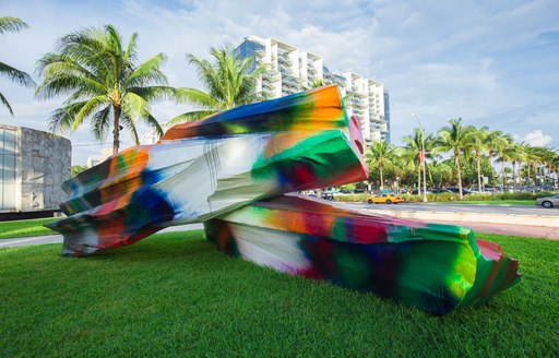large and colourful stone act as a think peice outside the entrance to art basel miami beach