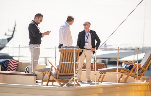 MYS visitors on deck of a berthed superyacht charter