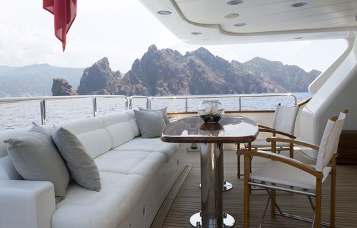 alfresco seating area on the main deck aft of charter yacht SALU