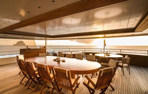 The outdoor dining space on board superyacht O'MEGA