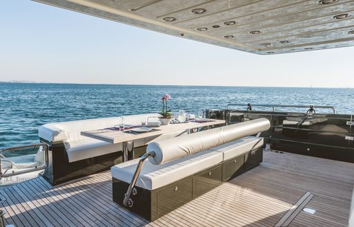 Aft main deck onboard charter yacht THIS IS MINE, alfresco lounge area with sea view 