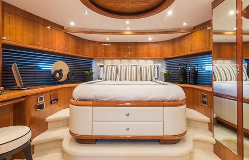 A guest cabin in the bow onboard charter yacht Winning Streak 2, central berth facing forward with mirror to starboard