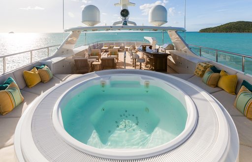 sundeck with Jacuzzi in foreground on luxury yacht MIM
