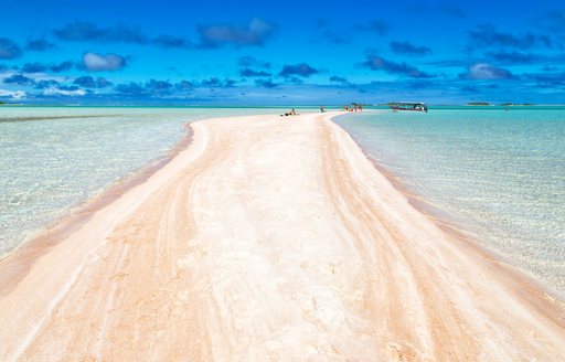 Long stretch of white sand in Tahiti
