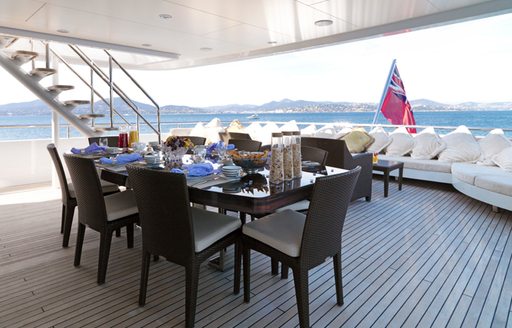 Aft deck dining area on board luxury yacht My Little Violet