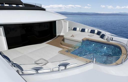 Sunpads and pool on superyacht RESILIENCE