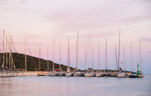 Superyachts lined up in Maslinica bay, Solta