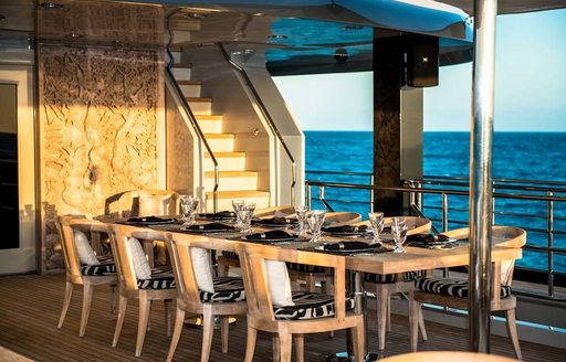 alfresco dining area on aft deck of superyacht  ‘Plan B’ 