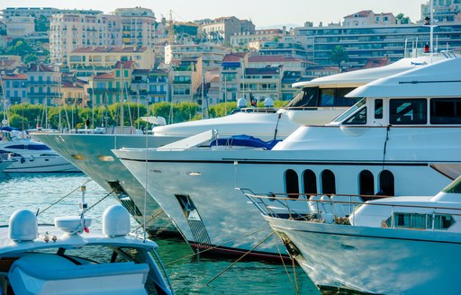 Bows of superyacht charters berthed at the Cannes Yachting Festival