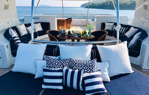 Alfresco lounge seating area on the sun deck onboard charter yacht LADY AZUL