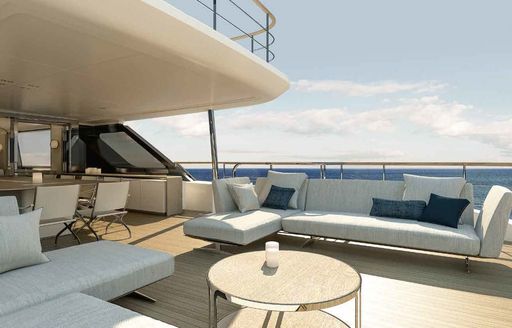 Aft exterior deck onboard charter yacht ALLURIA, ample seating with sweeping sea views