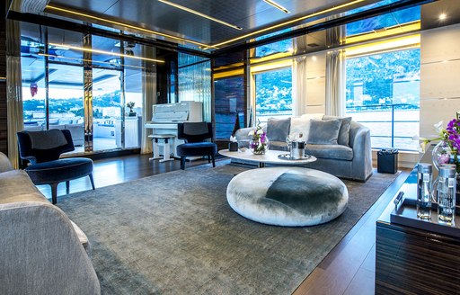 wide windows and modern furniture on board charter yacht PETRATARA